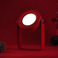 Red foldable touch dimmable portable lantern with circular led spotlight and handle for practical illumination