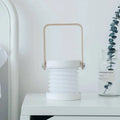 White foldable touch dimmable portable lantern with gold-toned metal handle for touch dimmable reading and night light