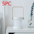 White foldable touch dimmable portable lantern with wooden handle and metallic accents for reading and night light use