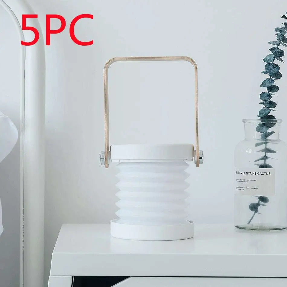 White foldable touch dimmable portable lantern with wooden handle and metallic accents for reading and night light use