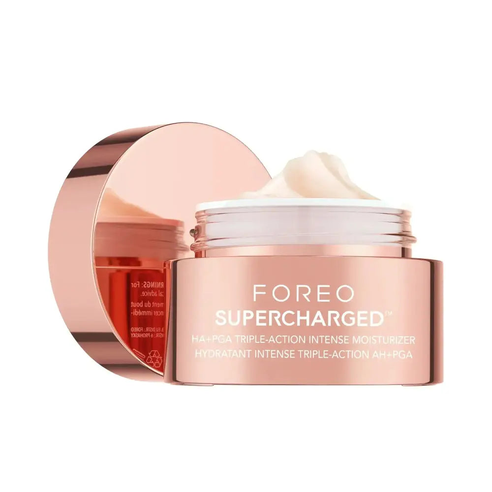 A rose gold metallic jar of foreo supercharged hyaluronic acid face moisturizer with creamy white product inside