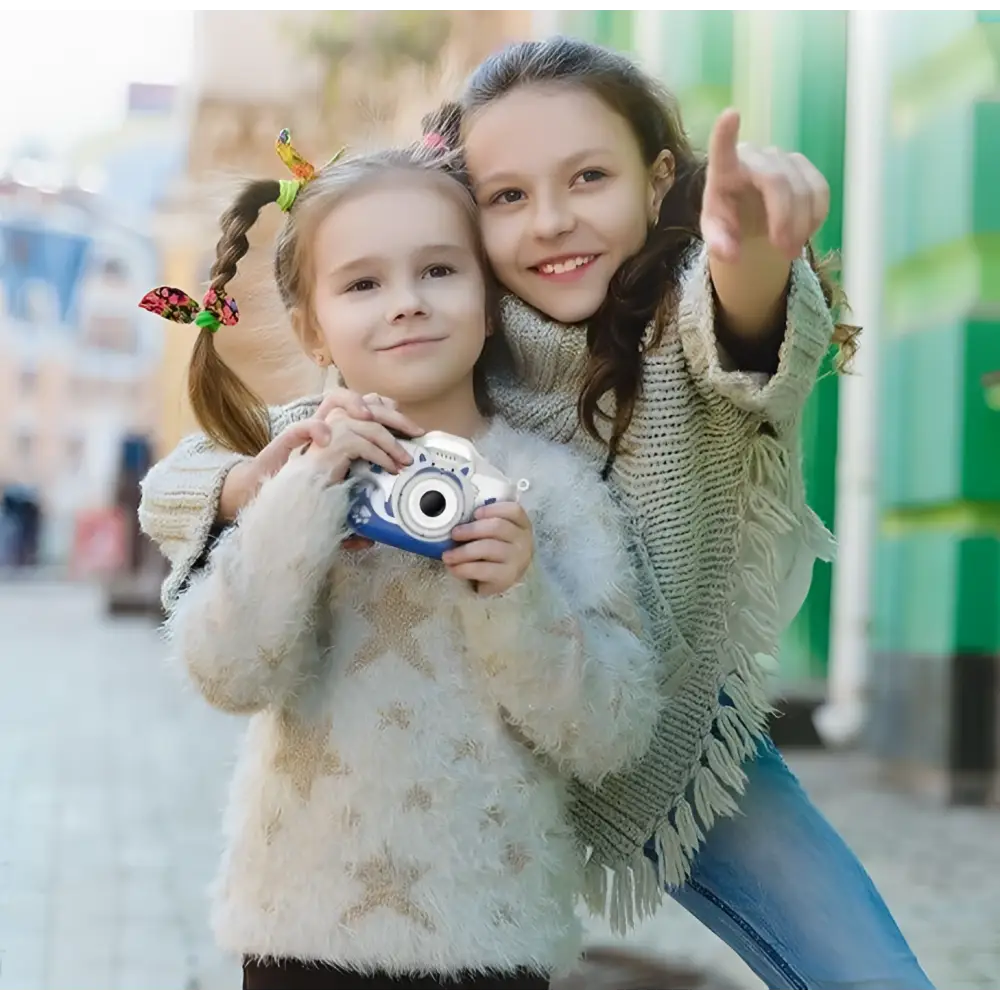 White and blue children’s digital camera with cat face design and paw print decals for playful photography