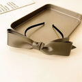 French satin bow headband for women in sleek olive green satin with black elastic band black bow headband