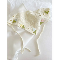 Delicate off-white crocheted triangular binder knitted headband with embroidered pastel flowers and green leaves