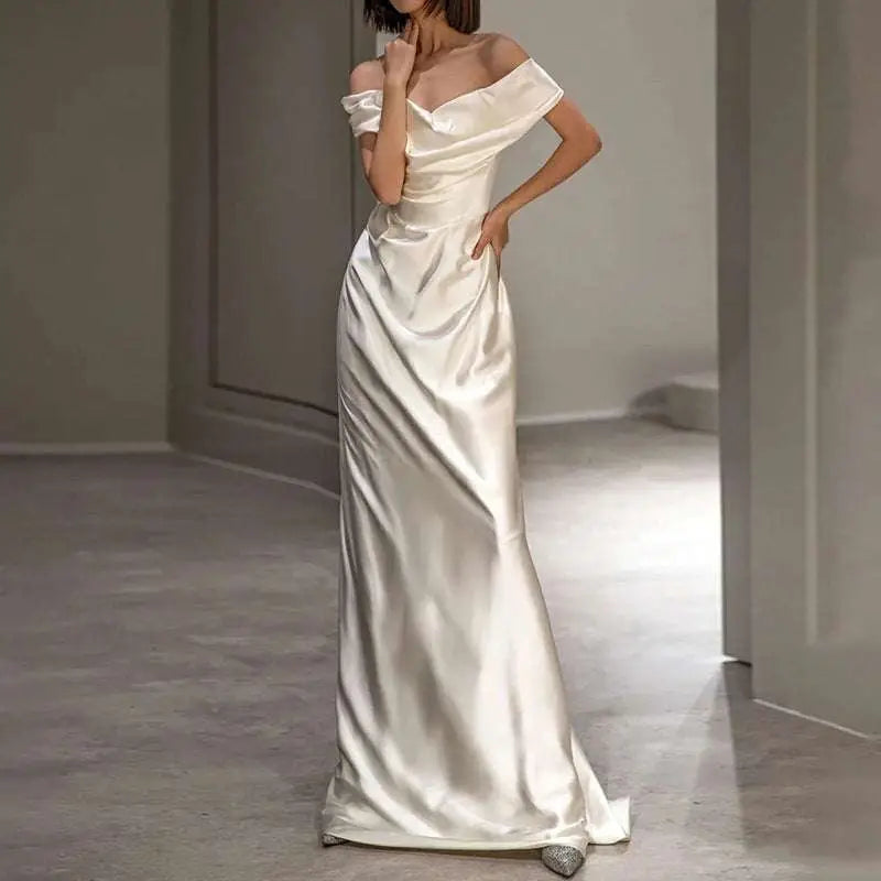 A french white off-shoulder satin wedding dress in soft ivory with a sleek silhouette and subtle bodice draping
