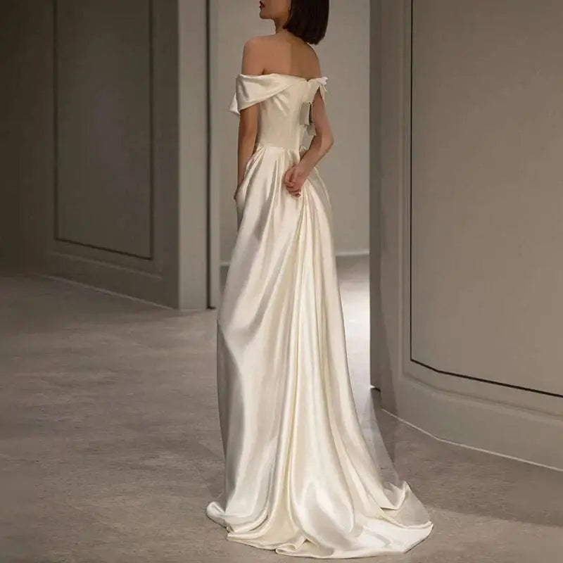 French white off-shoulder satin wedding dress in soft ivory with fitted bodice and elegant flowing train light wedding dress