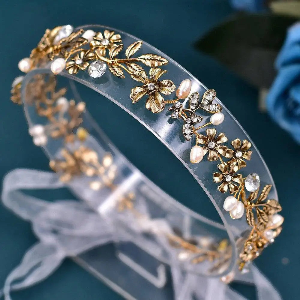 Delicate silver floral headband with gold-toned freshwater pearl leaf embellishments and sparkling crystal accents