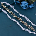 Gold-toned freshwater pearl silver floral headband with leaf design, pearls, crystals, and delicate sheer ribbon tails