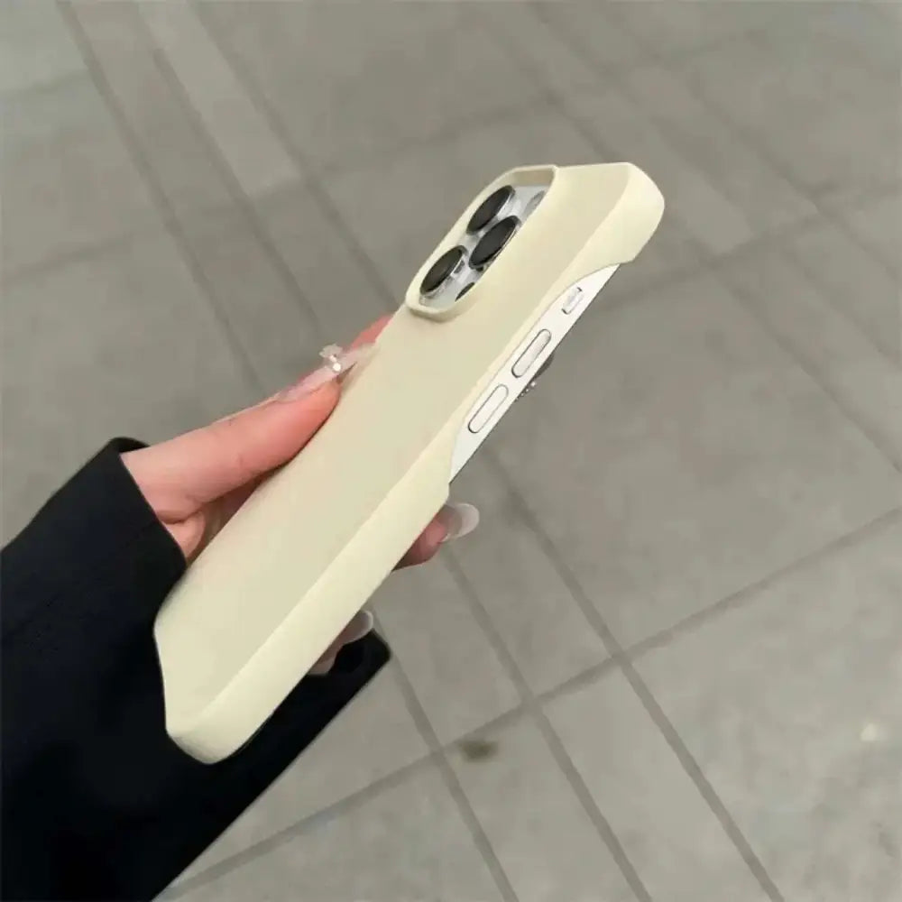 Cream-colored silicone frosted finish half-pack graphite case with matte finish and precise camera cutouts for heat dissipation