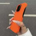 Bright orange frosted finish half-pack graphite case with black camera cutout designed for heat dissipation on back side