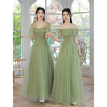 Two women wear matching fruit green fashion personalized long tulle dresses with off-the-shoulder ruffled sleeves