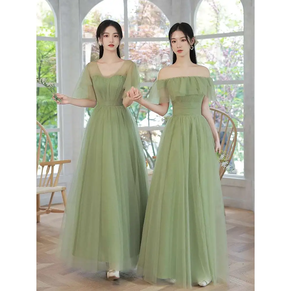 Two women wear matching fruit green fashion personalized long tulle dresses with off-the-shoulder ruffled sleeves
