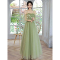A delicate fruit green fashion personalized long tulle dress with embroidered white flowers and sheer flutter sleeves