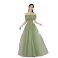 A flowing fruit green fashion personalized long tulle dress with off-the-shoulder fitted bodice and voluminous skirt