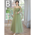 A flowing fruit green fashion personalized long tulle dress with sheer puff sleeves and floral embroidery at the waist