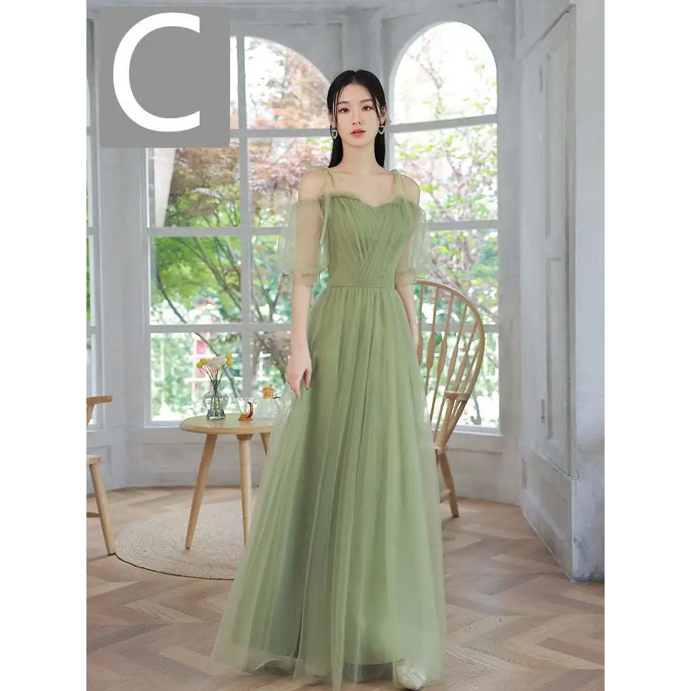 A flowing fruit green fashion personalized long tulle dress with sheer off-the-shoulder sleeves and fitted bodice