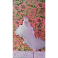 A white multi-layered ruffled wedding gown on a mannequin for a fuchsia layered ruffled flower girl tuxedo trailing dress
