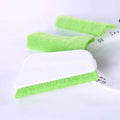Bright green rectangular gap brush with white plastic handle and textured sponge scrubber for cleaning window grooves