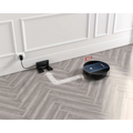 Black circular geek smart robot vacuum with strong suction and sleek modern design for efficient cleaning
