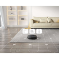 Black circular geek smart robot vacuum with sleek design and strong suction for efficient home cleaning