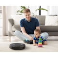 Black circular robot vacuum cleaner geek smart robot with strong suction and sleek modern design and subtle branding