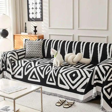 Black and white geometric chenille sofa cover with fringed edges for modern white chenille sofa protection and style