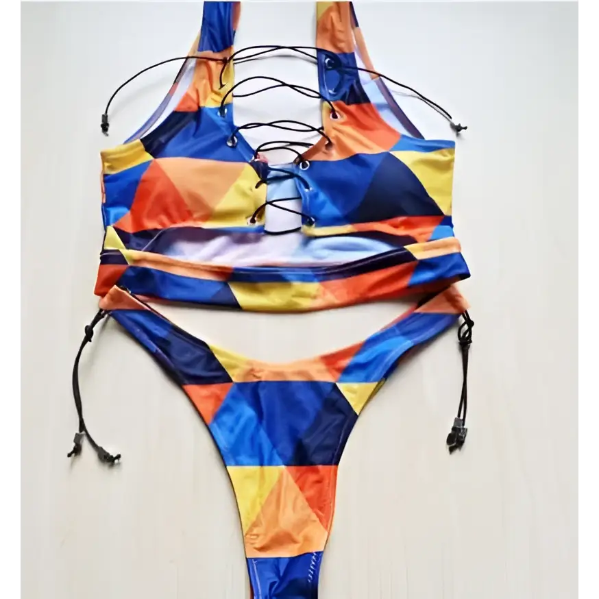A vibrant geometric halter swimwear thong bikini in bold blue orange and yellow with a lace-up front design for big boob women