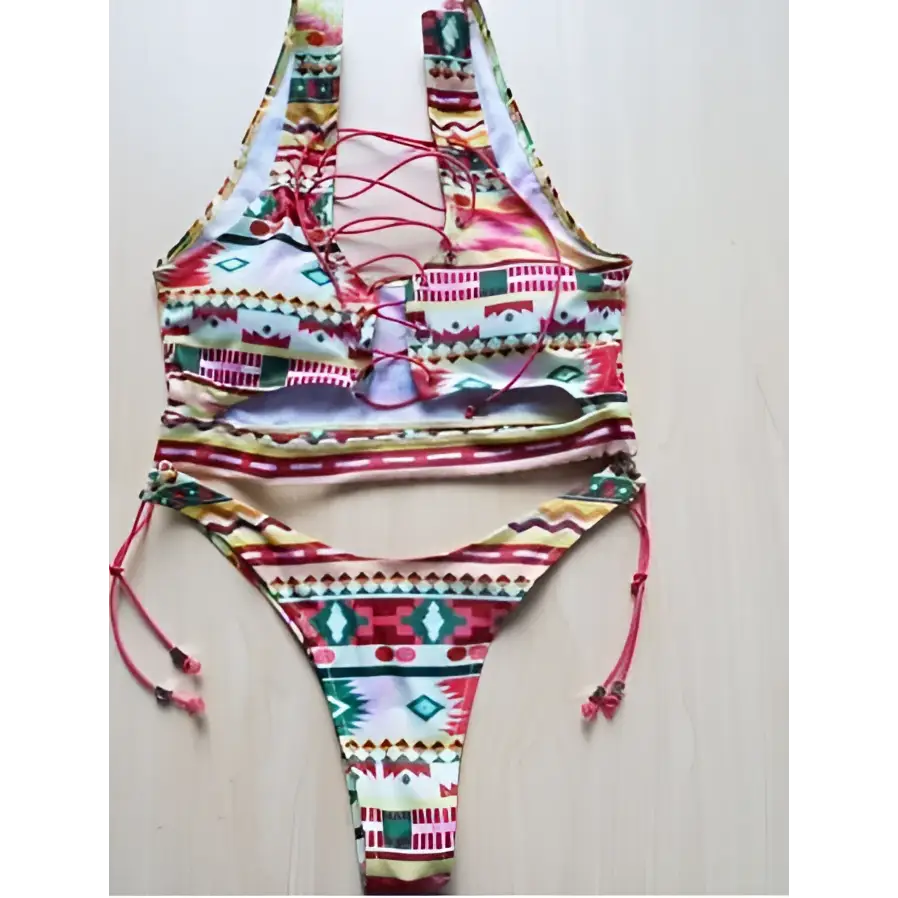 Vibrant geometric halter swimwear thong bikini in reds green and gold on stretchy fabric for big boob women