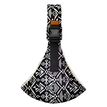 Black and white geometric patterned baby sling carrier with a black adjustable strap and orange buckle for secure use