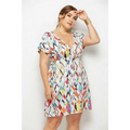 A vibrant plus-size printed deep v-neck dress with colorful geometric pattern and elastic waist on white fabric