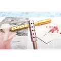 Rose gold germanium beauty roller with hexagonal head and black indentations for facial massage roller massage stick