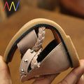 Girls braided beige sandals featuring silver studs, braided leather straps, and a tan rubber sole for comfortable wear