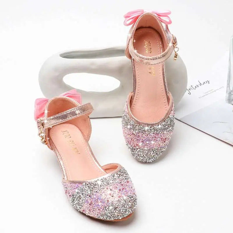 Pink and silver glittery girls high heel summer sandals with rhinestone sparkling bow on the strap