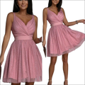 A shimmering pink glitter sleeveless deep v neck party dress with fitted waistband and pleated a-line skirt