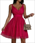 A vibrant fuchsia glitter sleeveless deep v neck party dress with fitted waistband in glitter tulle fabric