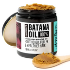 A black glass jar of golden-brown unrefined batana oil in glow restore hair mask for deep restore hair treatment