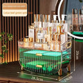 Transparent acrylic cosmetics storage box with gold-tone handles and legs, green illuminated interior, and two drawers