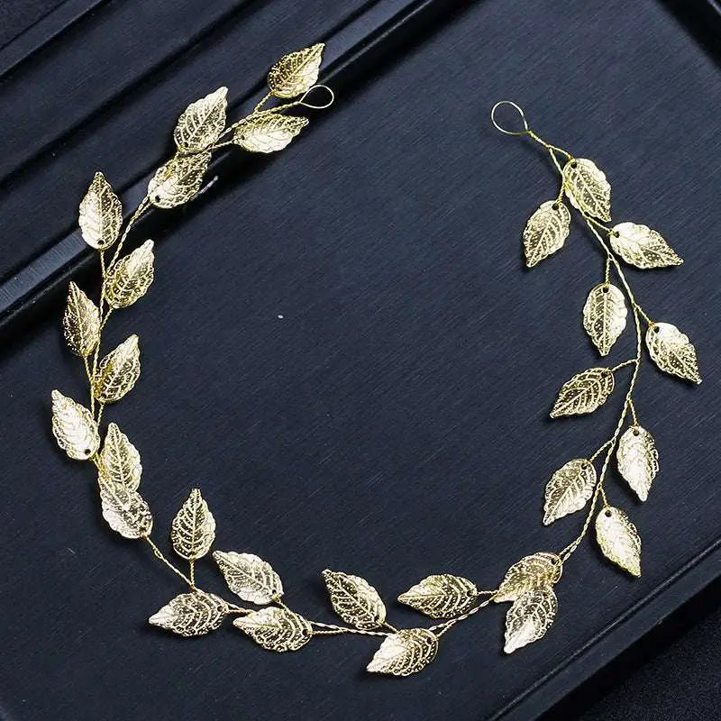 Gold and silver leaf hair band featuring a golden leafy headpiece with intricate filigree and delicate wire branches
