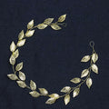 Gold and silver leaf hair band featuring a golden leafy headpiece with intricate wirework for elegant leaf hair styling
