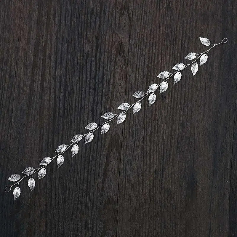 Gold and silver leaf hair band featuring a golden leafy headpiece with intricate filigree and delicate wire branches
