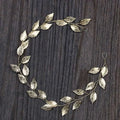 Delicate gold and silver leaf hair band with intricate metallic detailing for elegant leaf hair styling and golden leafy headpiece look