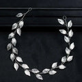 Gold and silver leaf hair band featuring an elegant silver leaf design with delicate textured leaves and slender branches