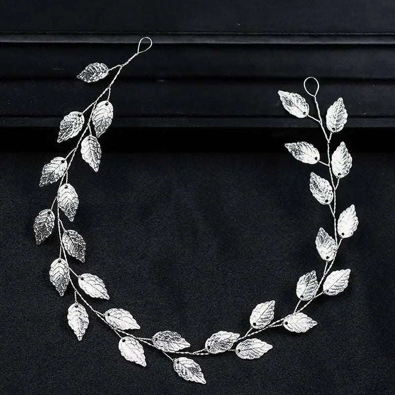 Gold and silver leaf hair band featuring an elegant silver leaf design with delicate textured leaves and slender branches
