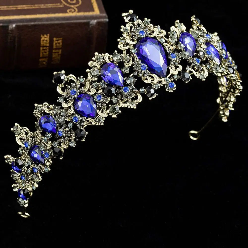 Gold baroque rhinestone crystal bridal crown featuring deep blue teardrop crystals and clear accent stones