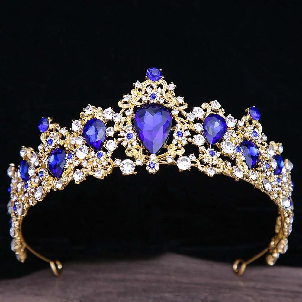 A sparkling gold baroque rhinestone crystal bridal crown with intricate filigree and pear-shaped teardrop crystals