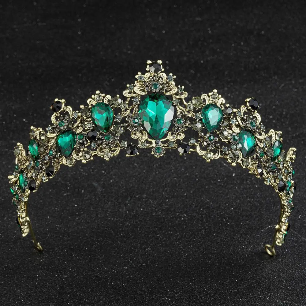 Gold baroque rhinestone crystal bridal crown featuring an ornate gold-toned tiara with emerald teardrop crystals and black accents