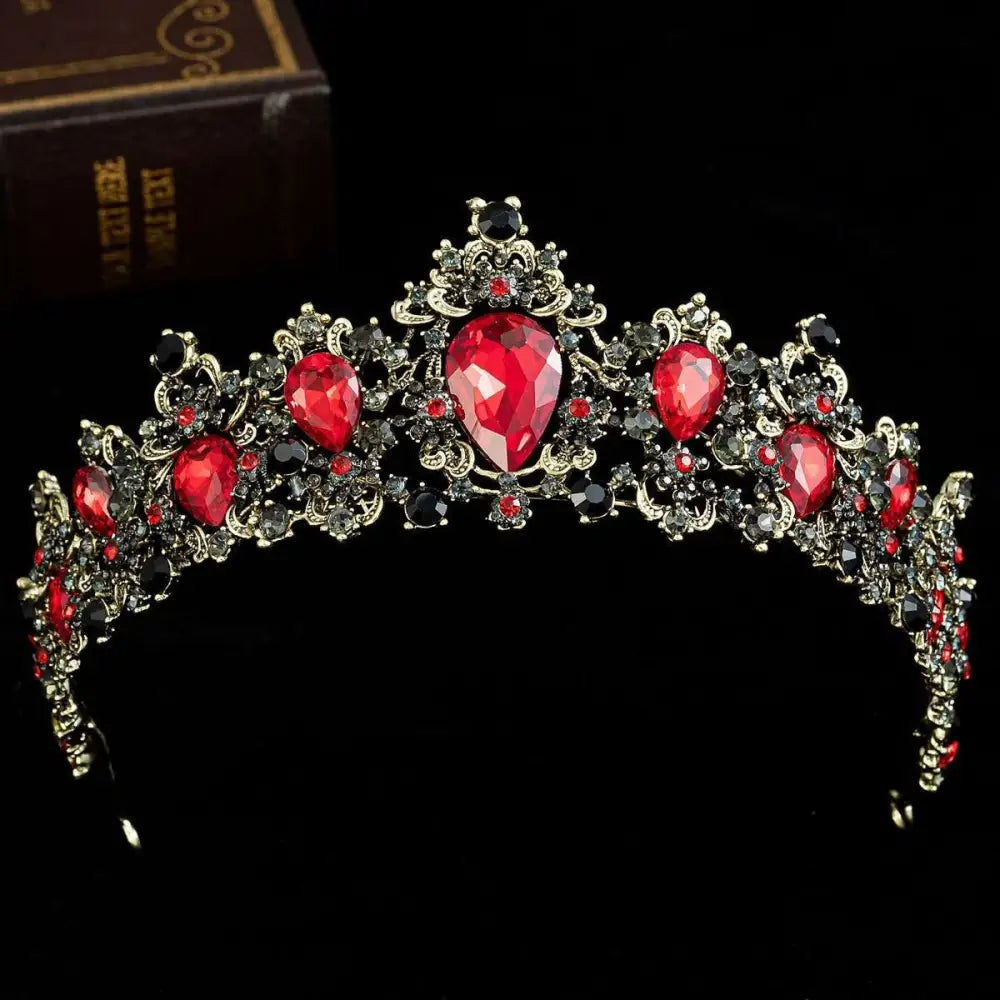 Elegant gold baroque rhinestone crystal bridal crown featuring red and black jeweled tiara with intricate filigree design