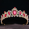 A gold baroque rhinestone crystal bridal crown with red and clear crystals in an intricate floral design