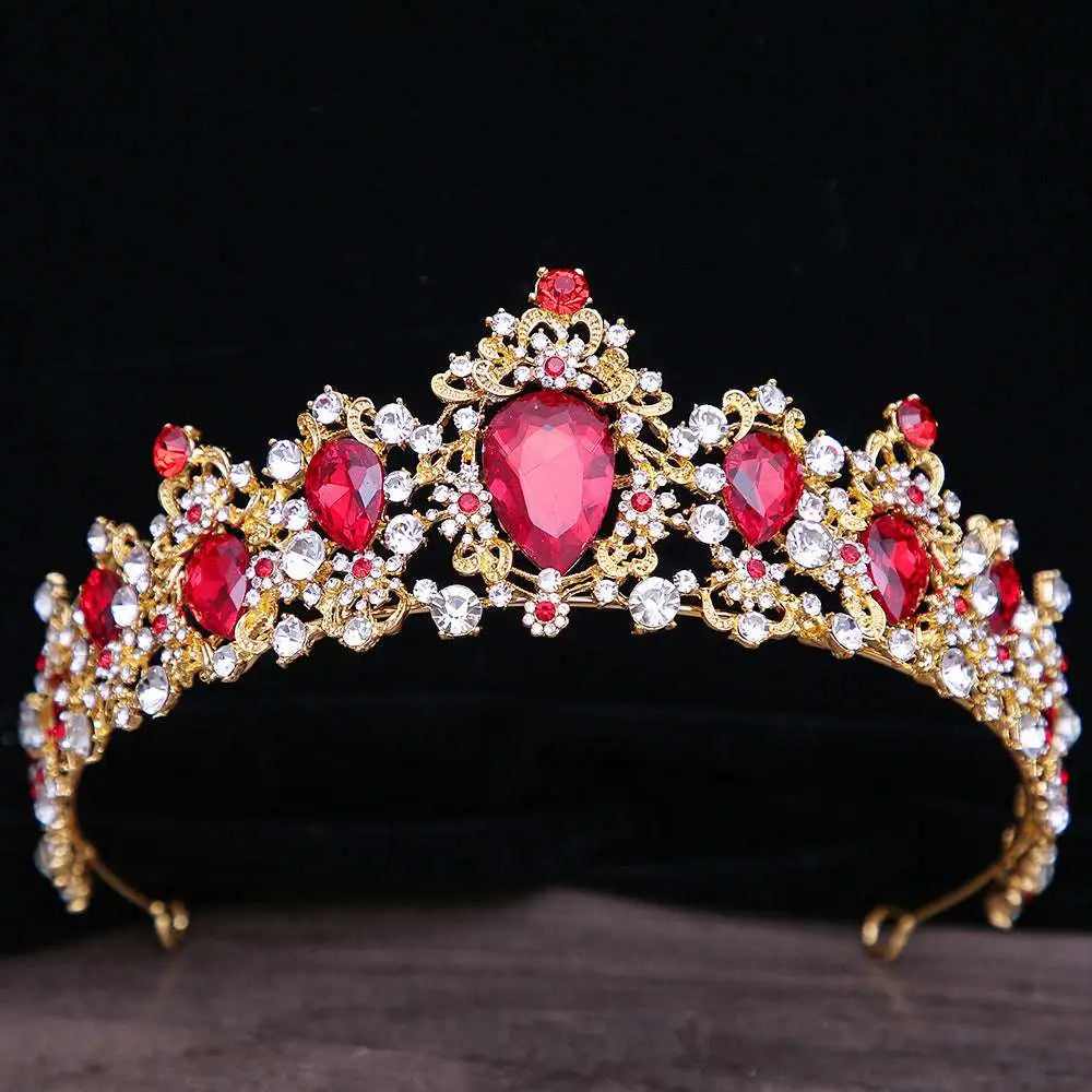 A gold baroque rhinestone crystal bridal crown with red and clear crystals in an intricate floral design