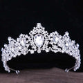 A sparkling silver crystal bridal crown with intricate filigree and large pear-shaped baroque rhinestone crystals